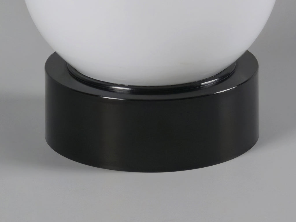 1960s vintage MCM globe glass light fixture by Corodex Holland, macro shot of the black bakelite base showing the clean and smooth texture.