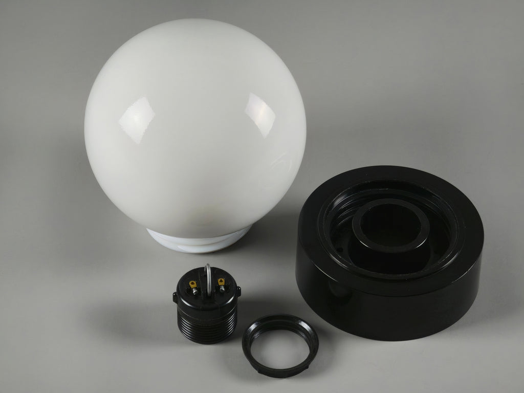 Dismantled shot of the 1960s vintage MCM globe glass light fixture by Corodex Holland, showing the fittings and bulb socket.