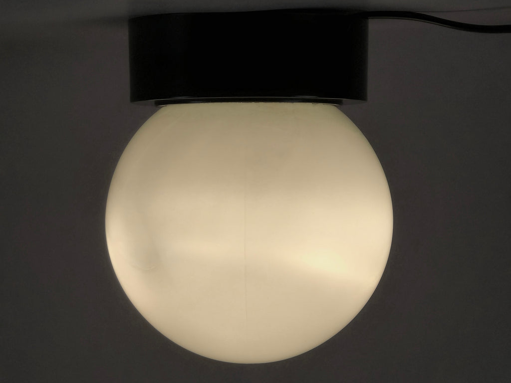 1960s vintage MCM globe glass light fixture by Corodex Holland, showing profile, ceiling mounted and lit.