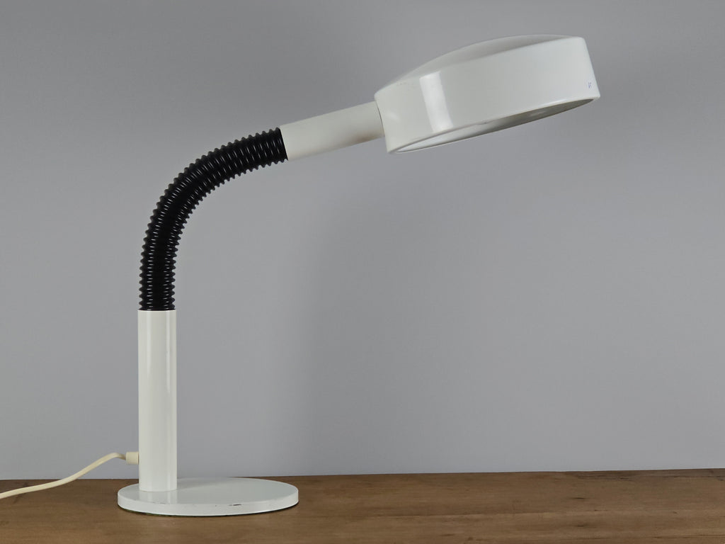 1960s Mid Century Modern gooseneck desk lamp by Hala Zeist, the image shows the lamp in profile view, on a vintage wooden table.