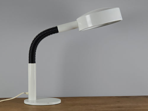 1960s Mid Century Modern gooseneck desk lamp by Hala Zeist, the image shows the lamp in profile view, on a vintage wooden table.