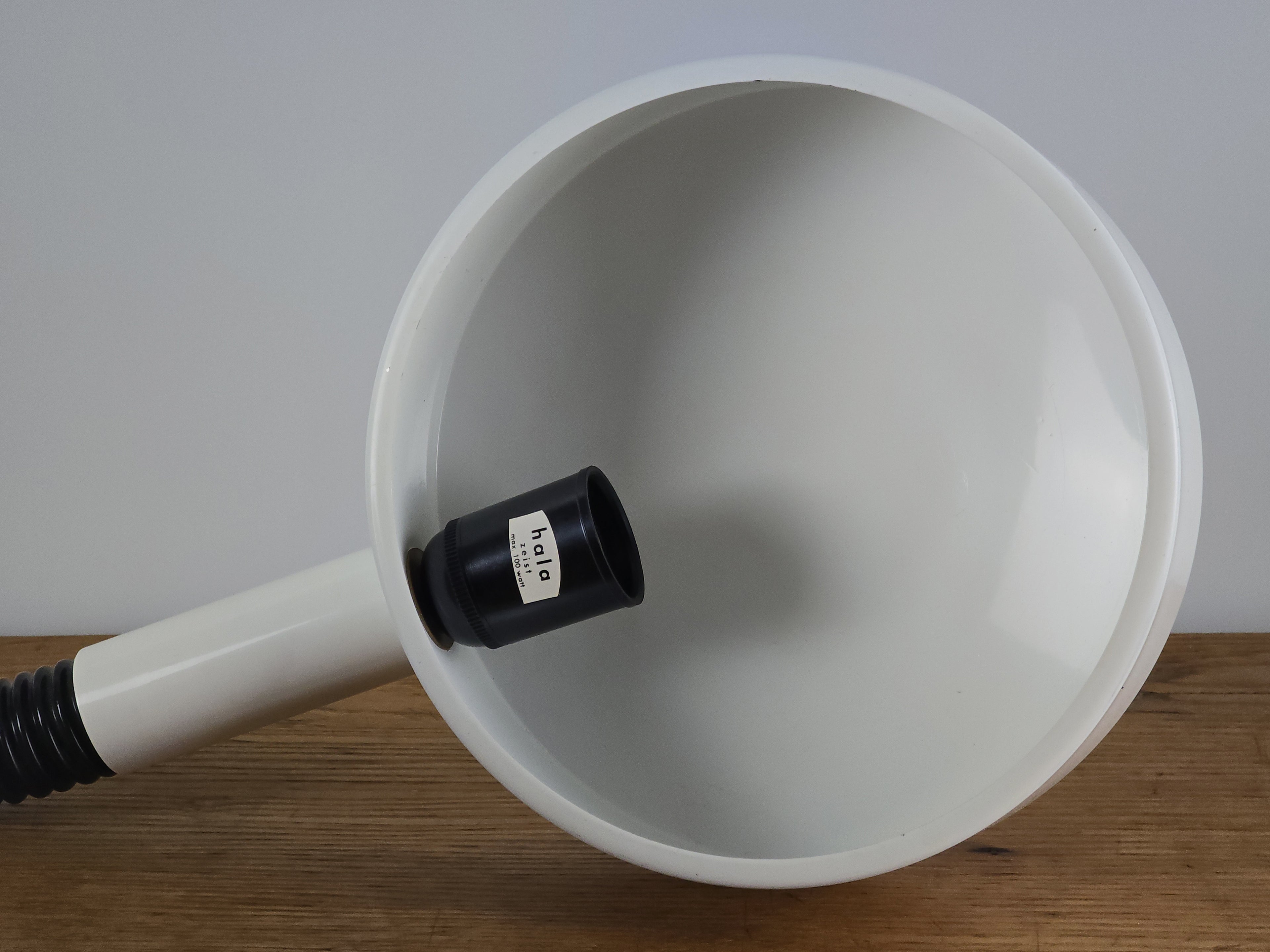 1960s Mid Century Modern gooseneck desk lamp by Hala Zeist, macro shot of the inner side of the round shade, showing the metal texture and the original Hala sticker.