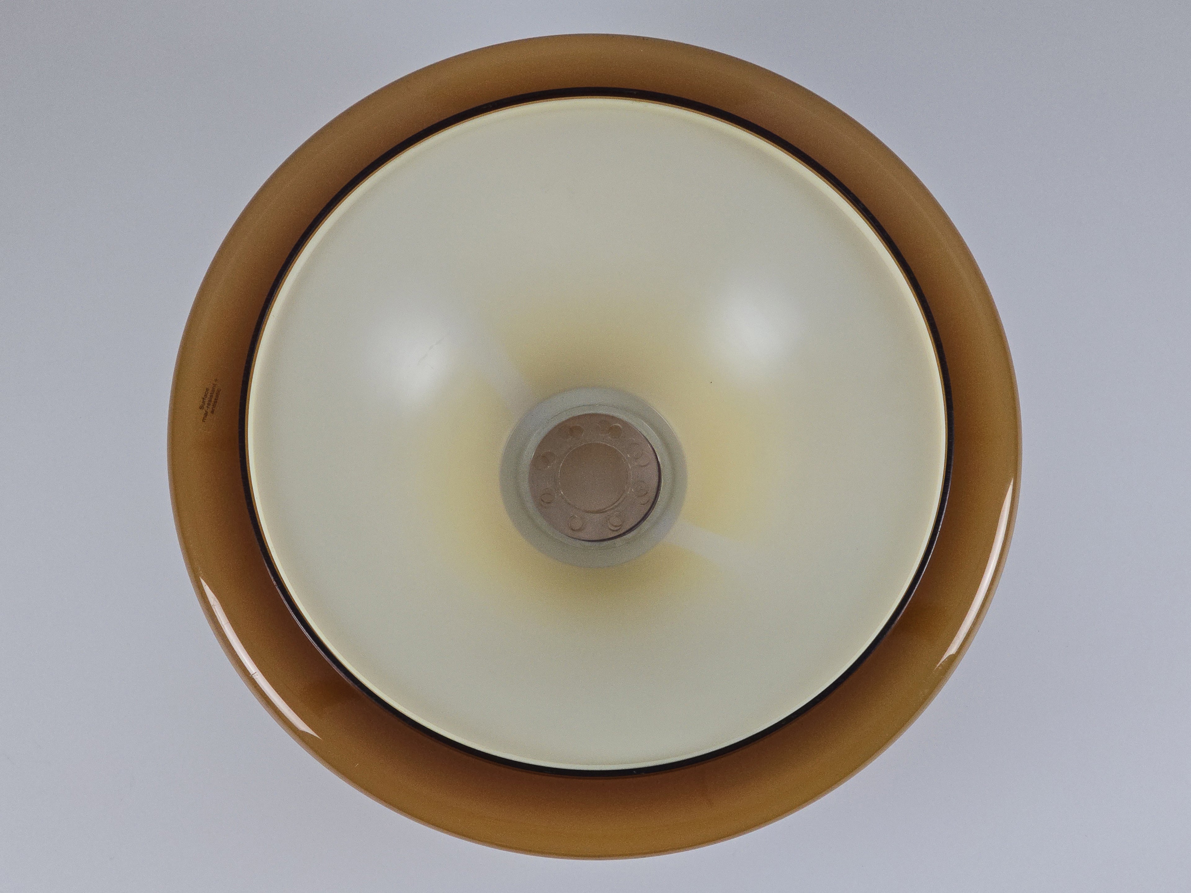 Top-down view inside the shade showing the white interior lining designed for optimal light reflection.