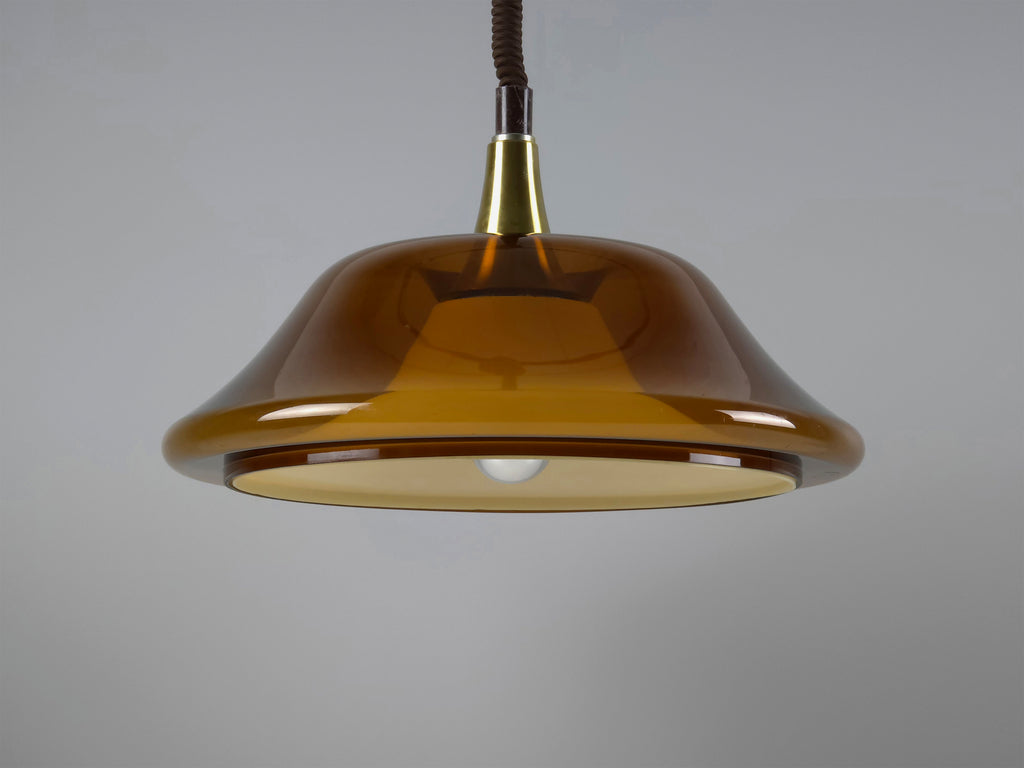 Side profile of the 1970s pendant light, emphasizing the sleek, curved lines of the modernist design.