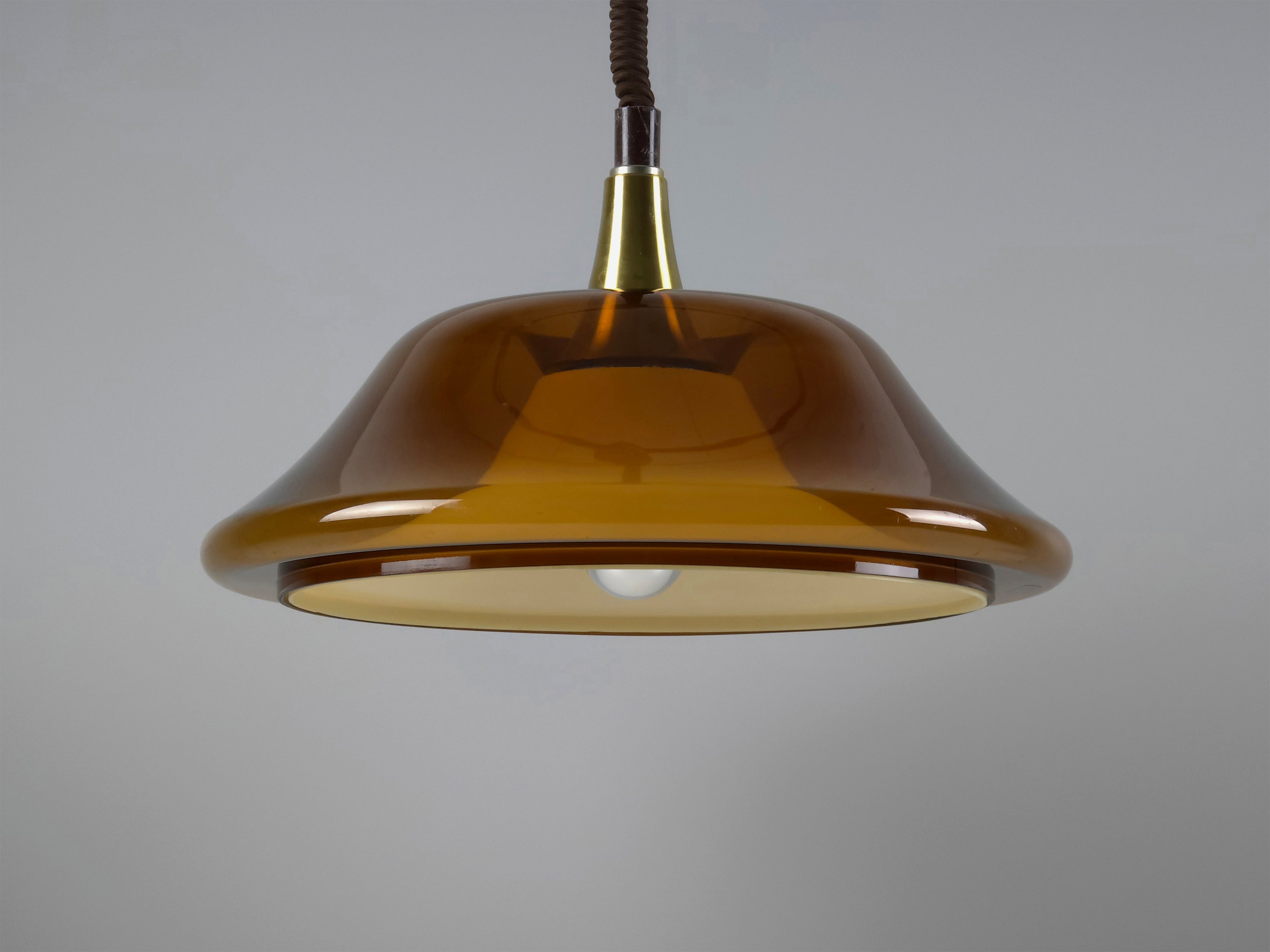 Side profile of the 1970s pendant light, emphasizing the sleek, curved lines of the modernist design.