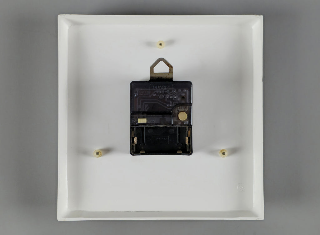 1970s Space-Age Design Blessing orange plastic wall clock, back view showing the movement.