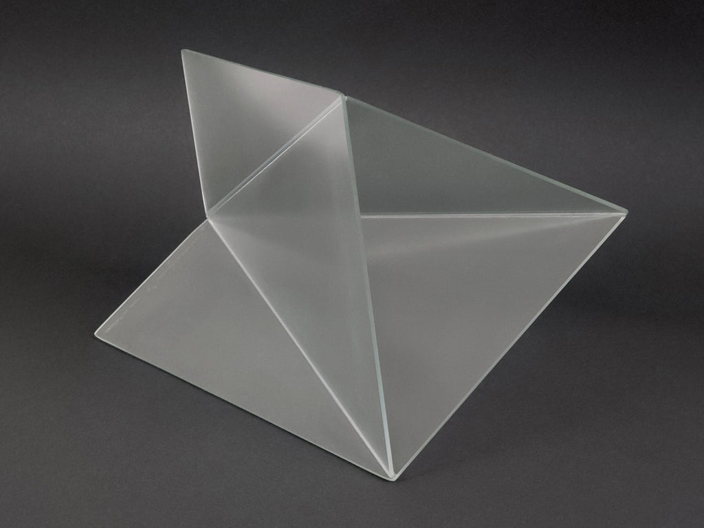 1981 Mart van Schijndel Delta vase, Dutch postmodern design iconic frosted glass vase, the vase here is on it's side showing another angle for the viewer to get a good grasp of the volumes. The background is dark which shows the cleanliness of the frosted glass.