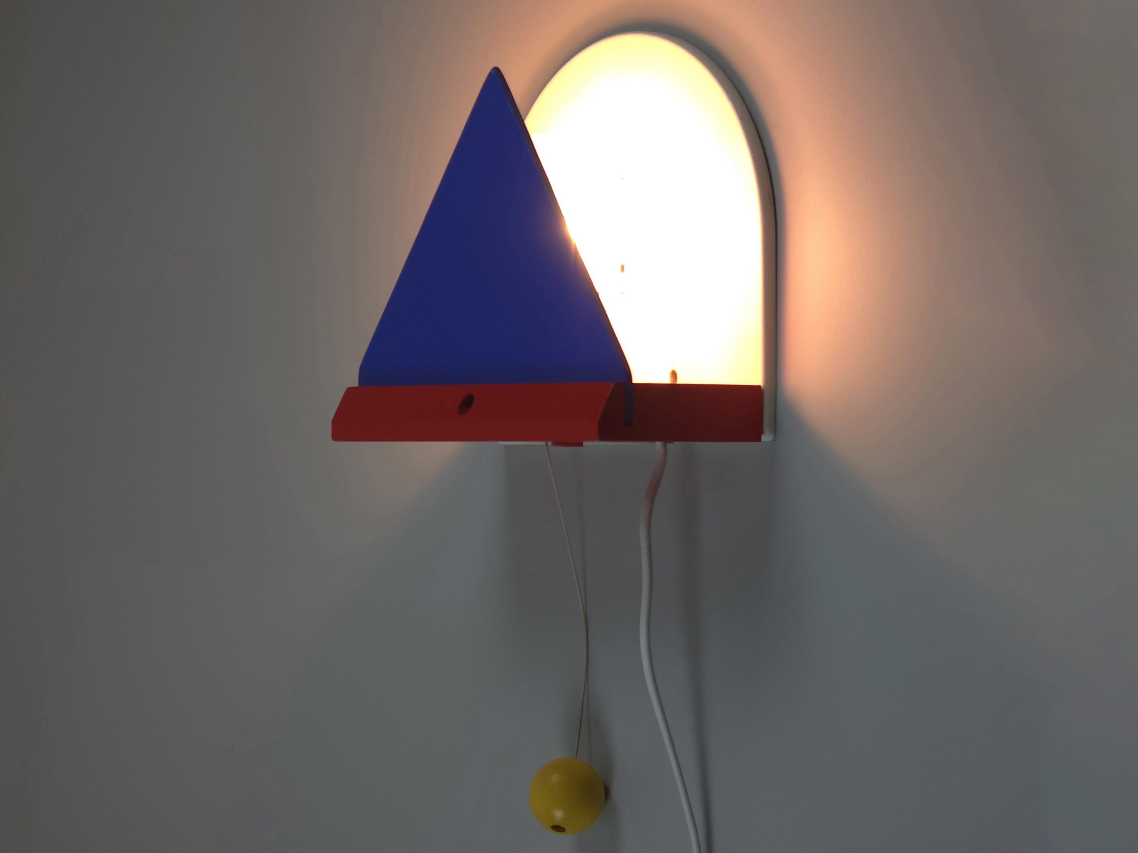 1987 Vintage IKEA V716 Stoja wall lamp main image, showing the lamp wall mounted and lit.