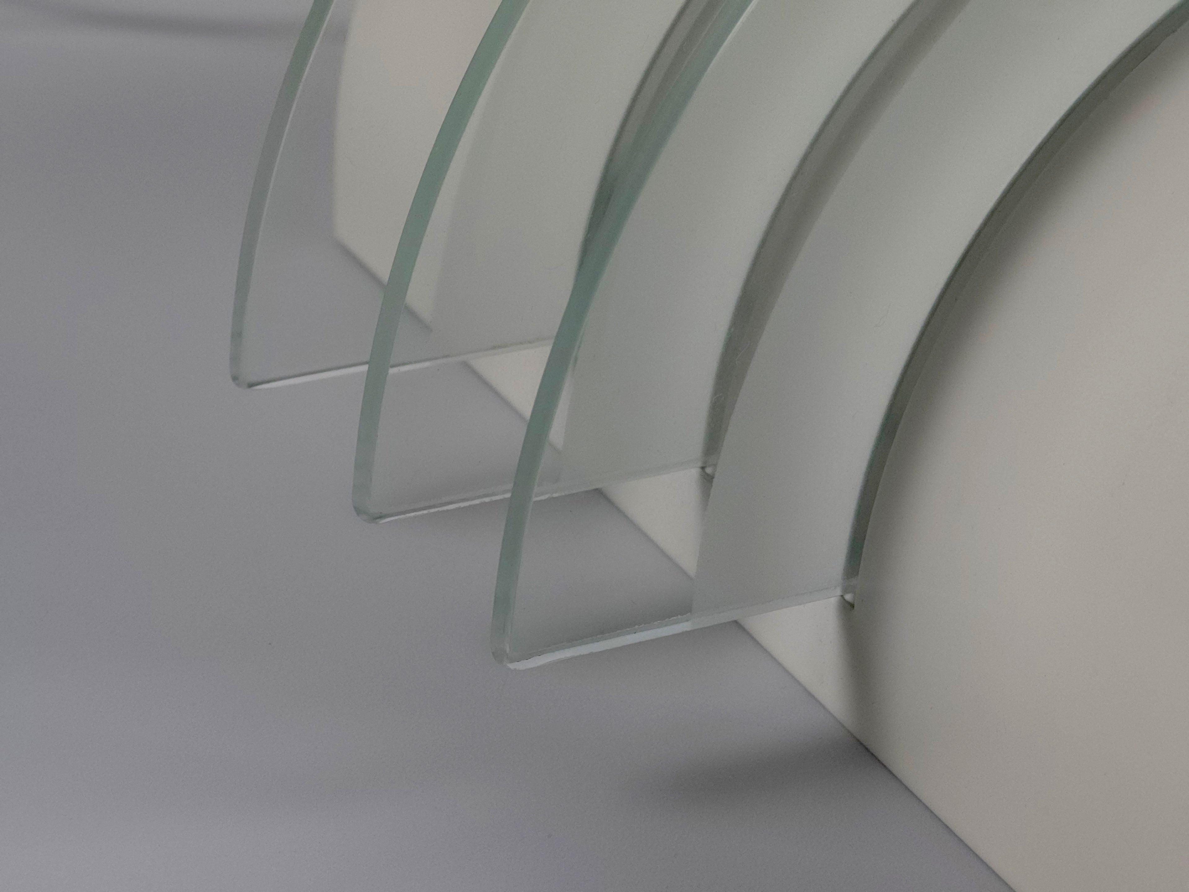 Close-up of the thick stepped glass discs of the IKEA Drittel lamp, highlighting the vintage postmodern material quality.