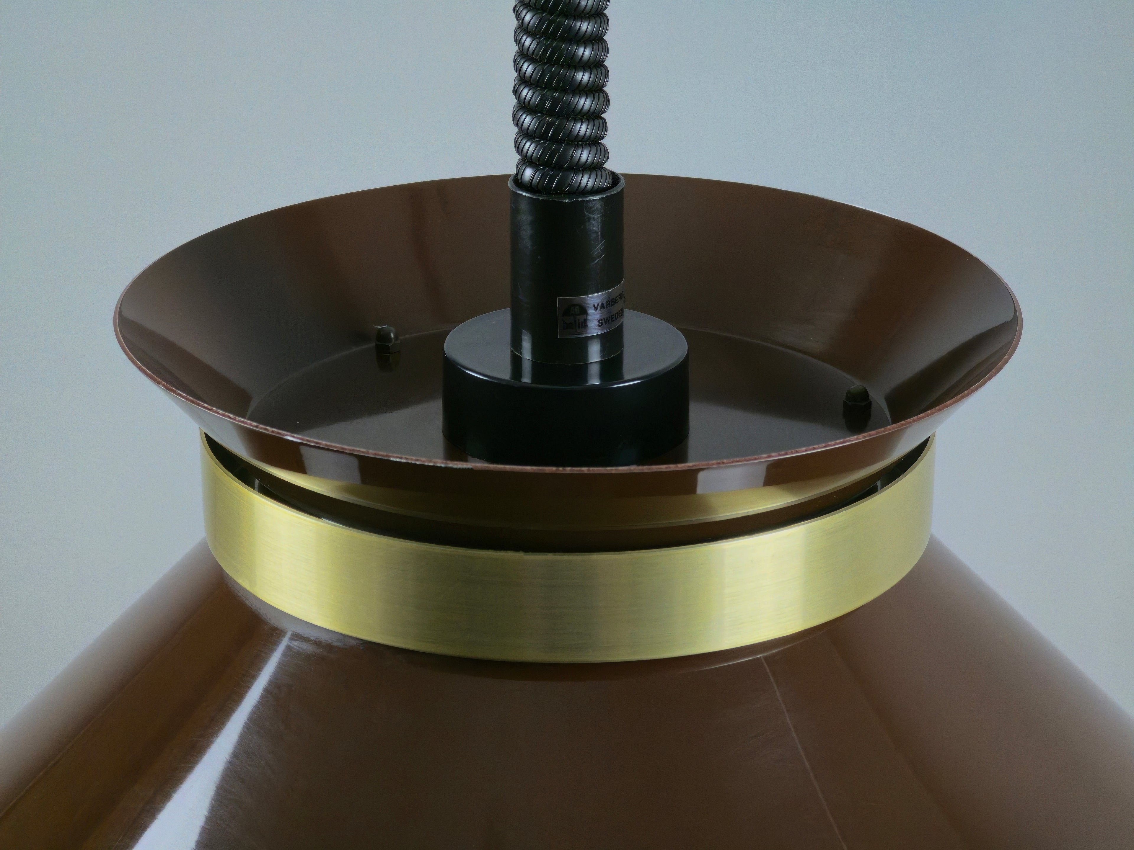 Top down detail of brass ring on vintage Belid pendant lamp.