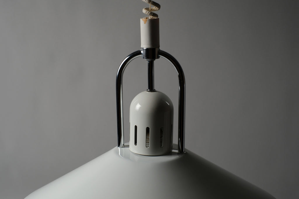 Close-up of the suspension ring and ceiling mount hardware of a 1980s Belid T127 pendant lamp attributed to Jan Eskil Eskilsson, showing the original chromed metal bracket and coiled rise-and-fall cord, Sweden.