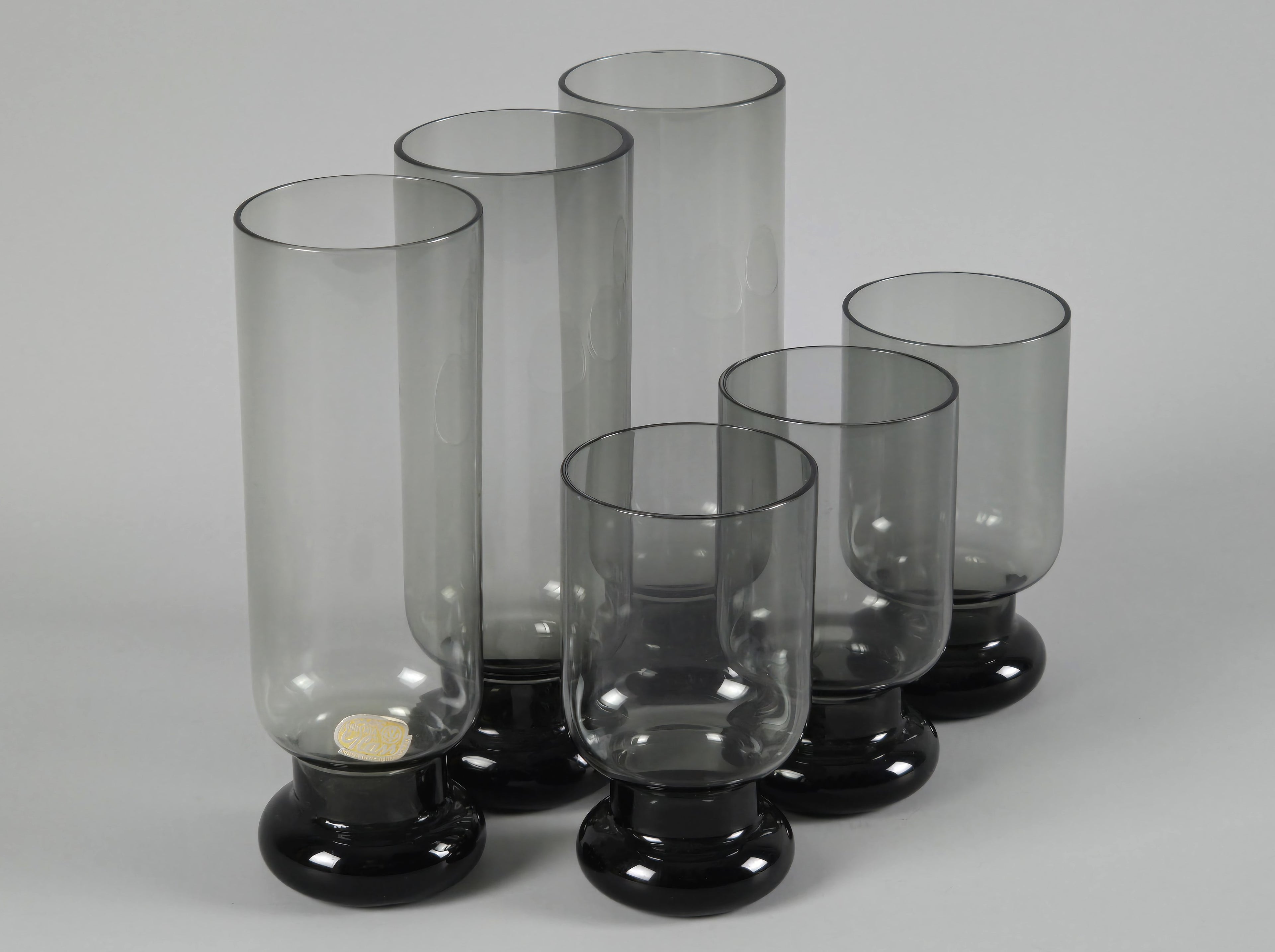 Set of six vintage 1970s Bohemia Glass tumblers in smoke grey, featuring three tall highball glasses and three shorter glasses.