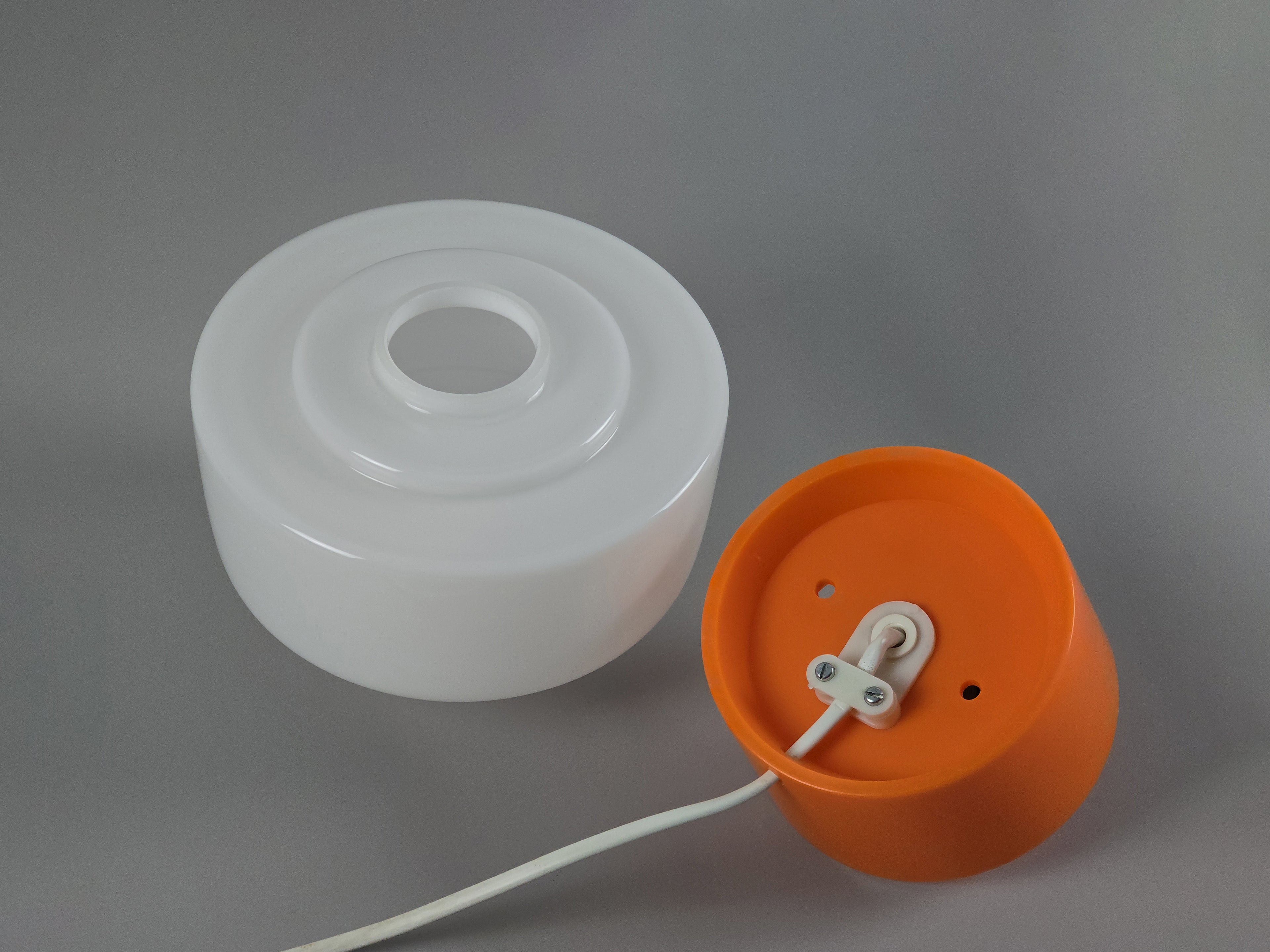 detailed image showing the underside of the mushroom lamp with the glass and plastic texture