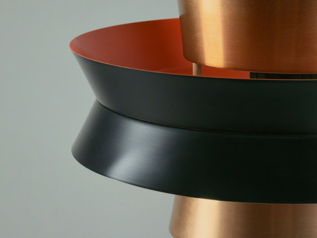 detailed profile photo showing the black metal discs of the pendant lamp