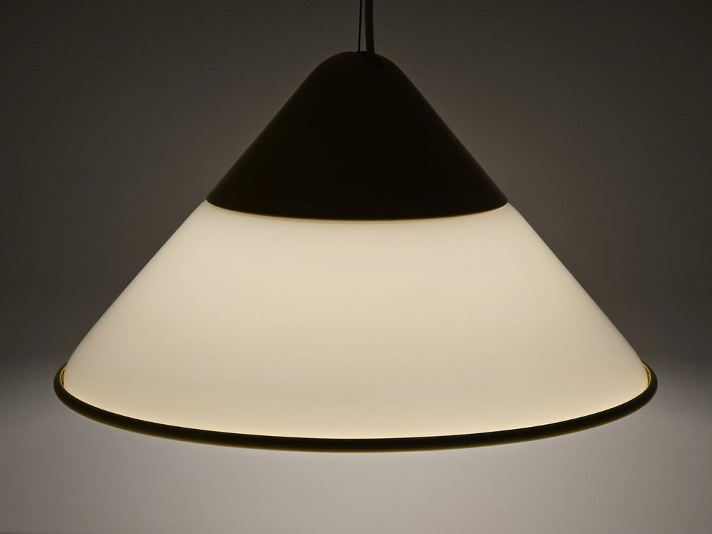 1980s Vintage Fabbian Italian opaline glass pendant lamp, Mid-Century Modern conical white opal hand-blown glass with yellow design details, fully lit view from upper side.