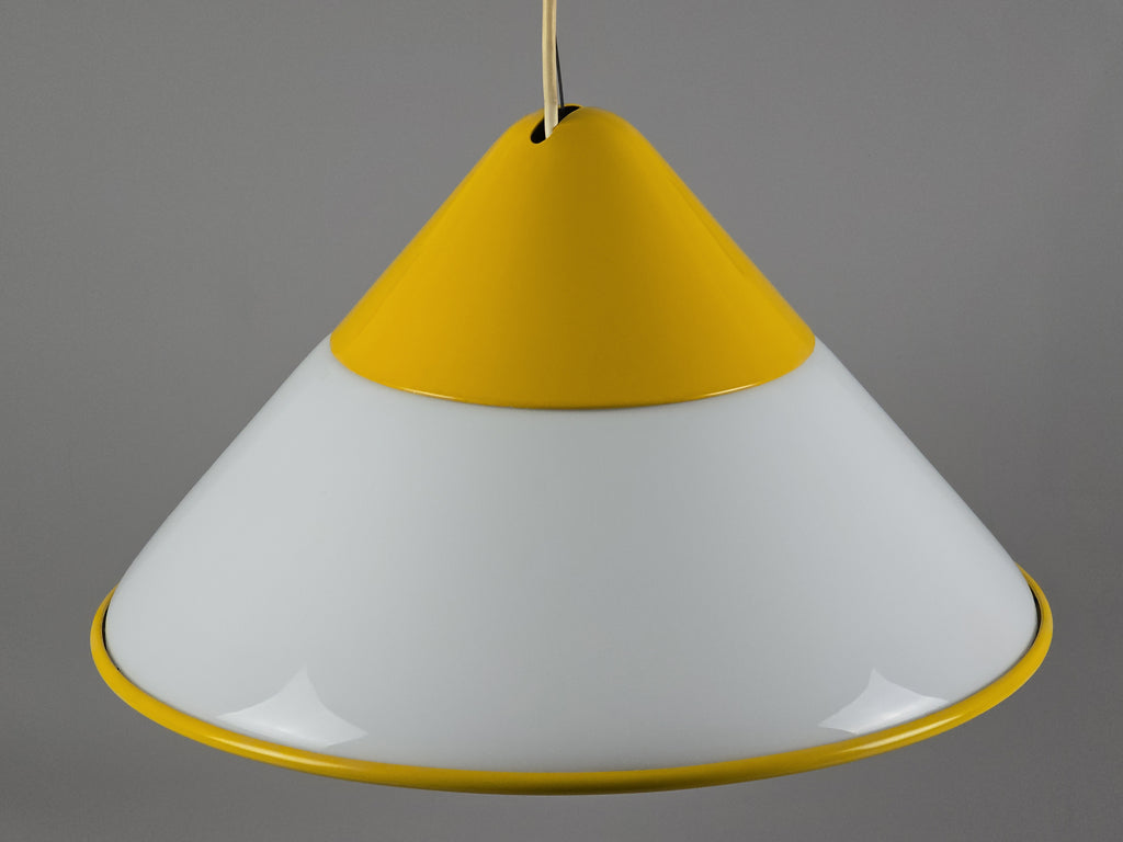 1980s Vintage Fabbian Italian opaline glass pendant lamp, Mid-Century Modern conical white opal hand-blown glass with yellow design details, yellow metal lamp cover detail.