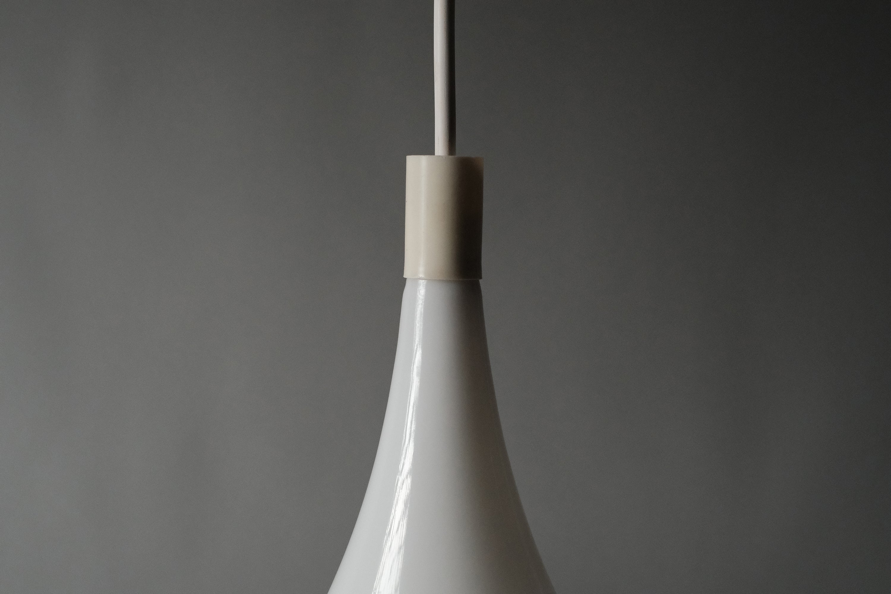 Detail shot of the Dijkstra heksenhoed pendant lamp upper body, showing the trumpet neck and opaline acrylic surface texture