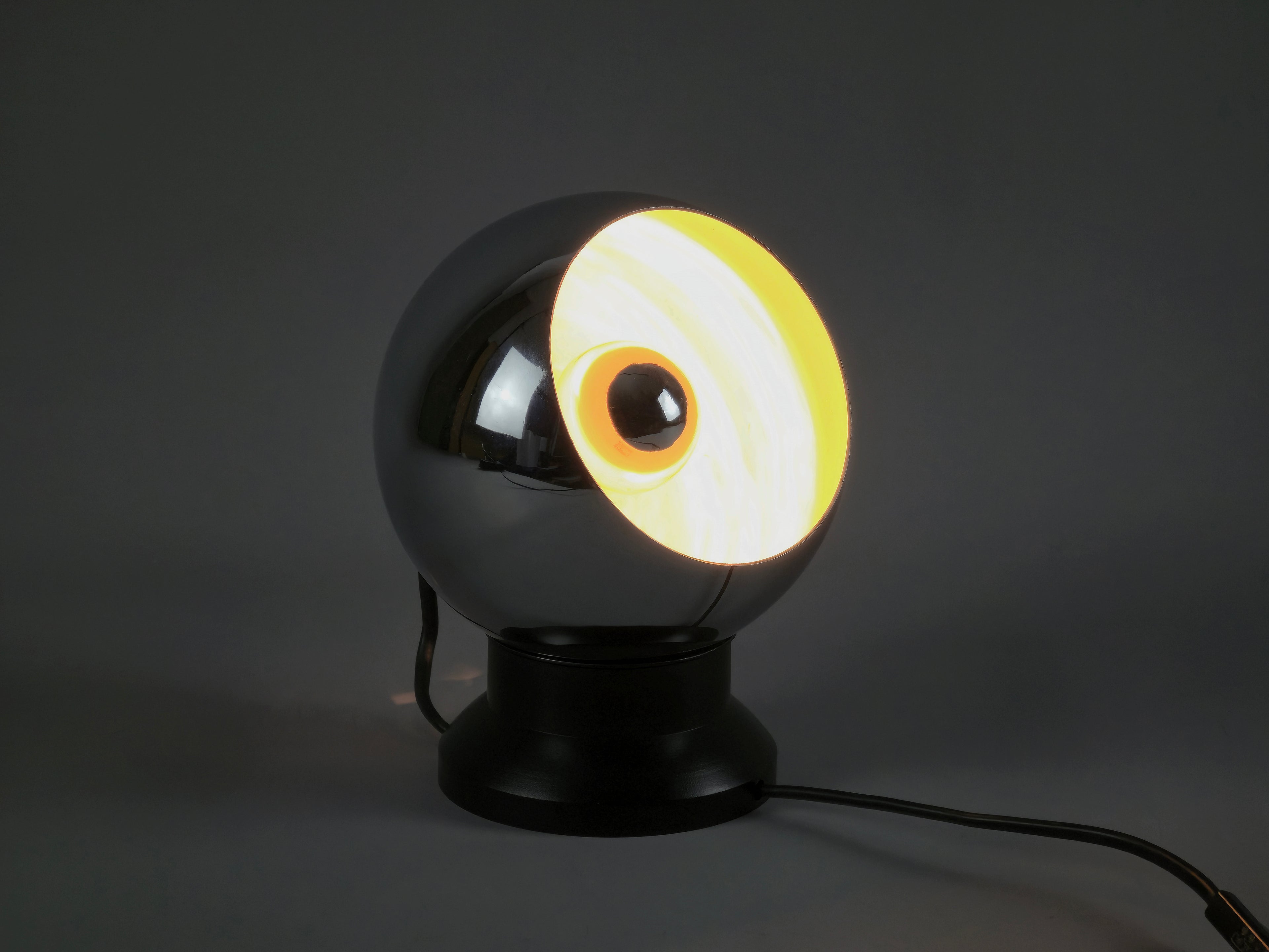 Angled view of the E.S. Horn eyeball light lit in the dark.