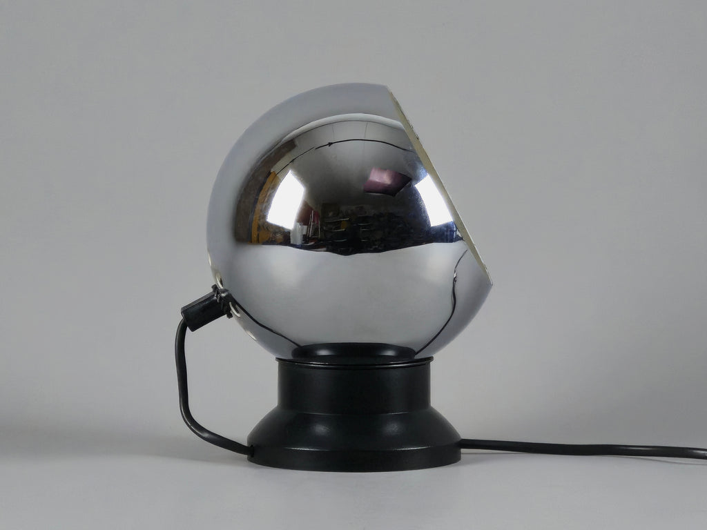 Profile of vintage E.S. Horn magnetic ball table lamp in chrome and black with neutral background.