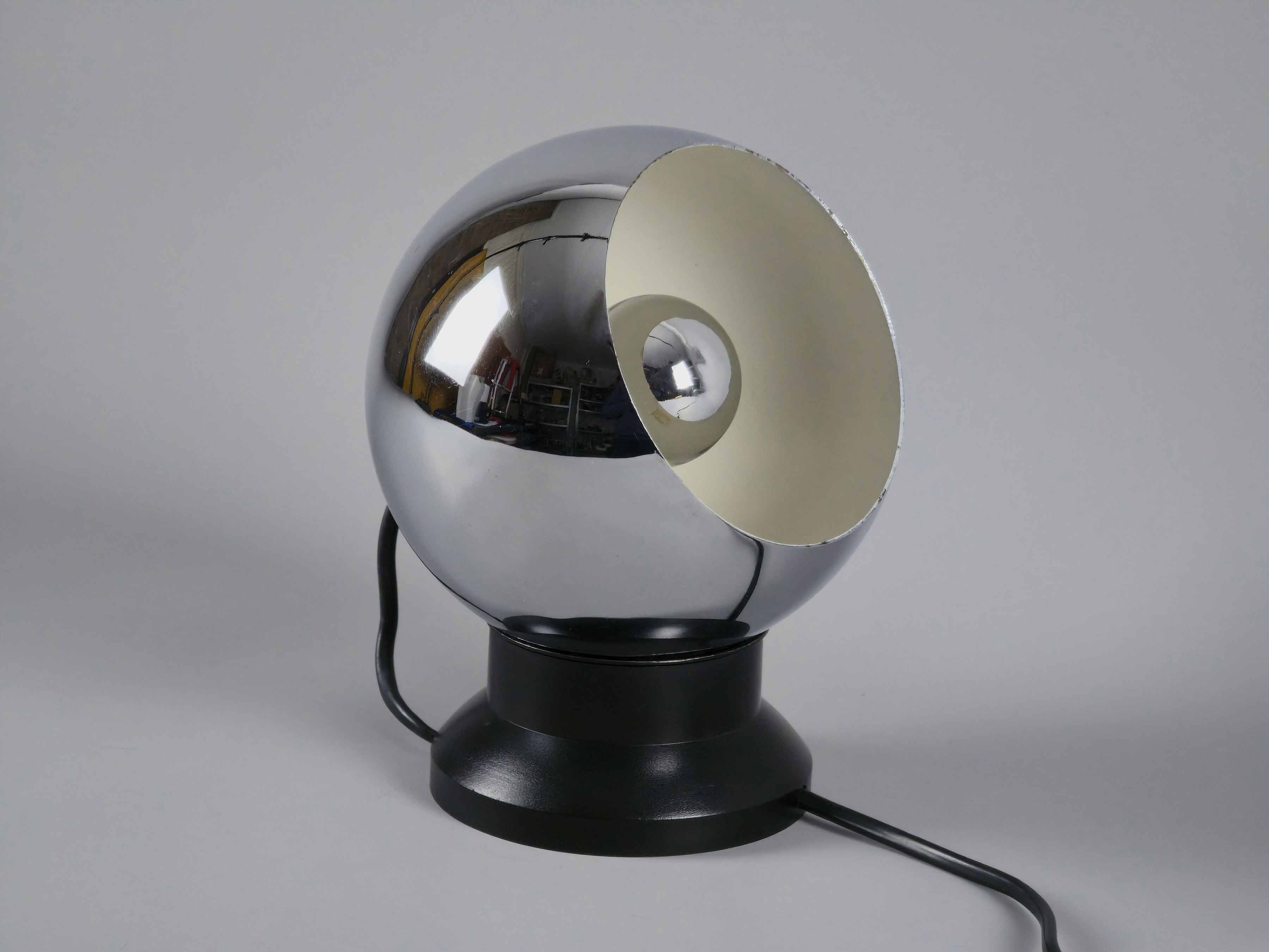 Side profile of vintage E.S. Horn magnetic ball table lamp in chrome and black.