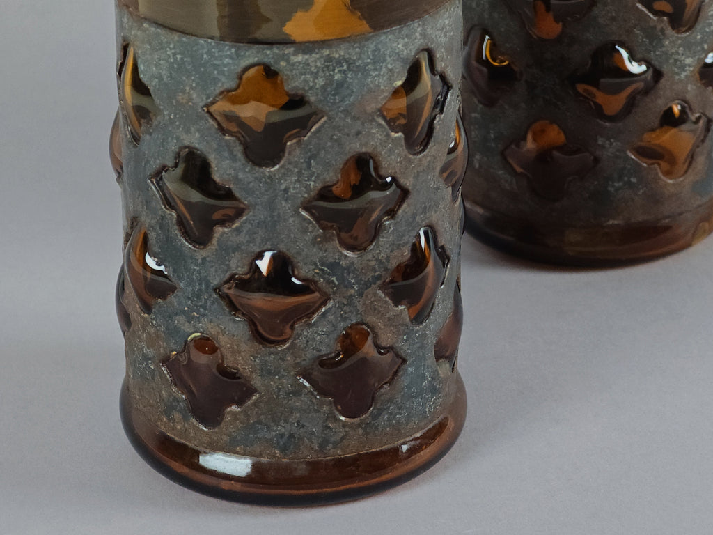 Macro detail of the metal cage construction on a Felipe Derflingher imprisoned glass.