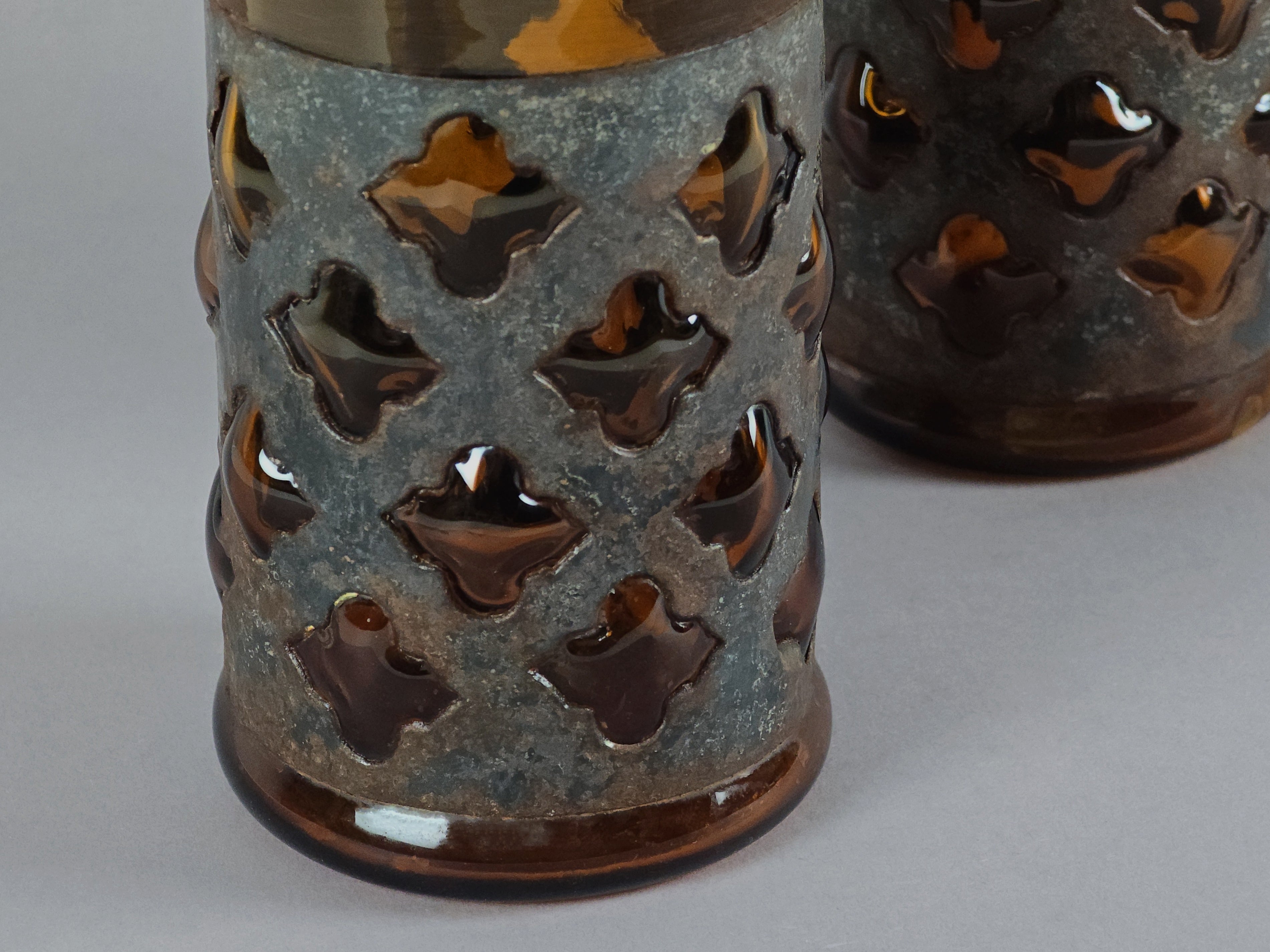 Macro detail of the metal cage construction on a Felipe Derflingher imprisoned glass.