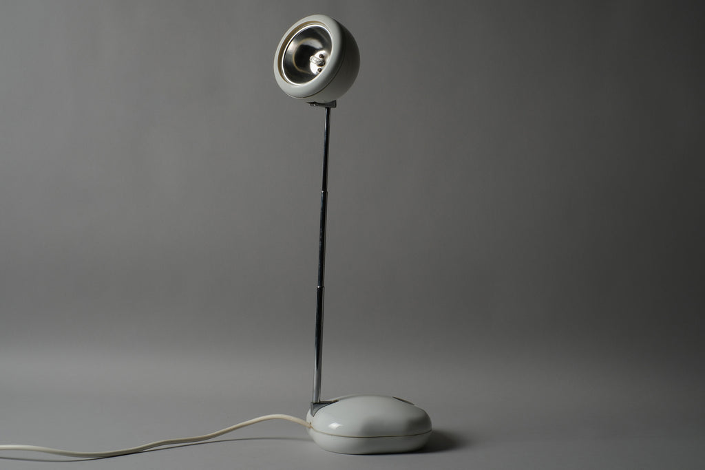 Full-length view of a 1970s Hustadt Leuchten antenna halogen desk lamp from West Germany with the telescopic stem fully extended, showing the complete antenna form and oval weighted base.