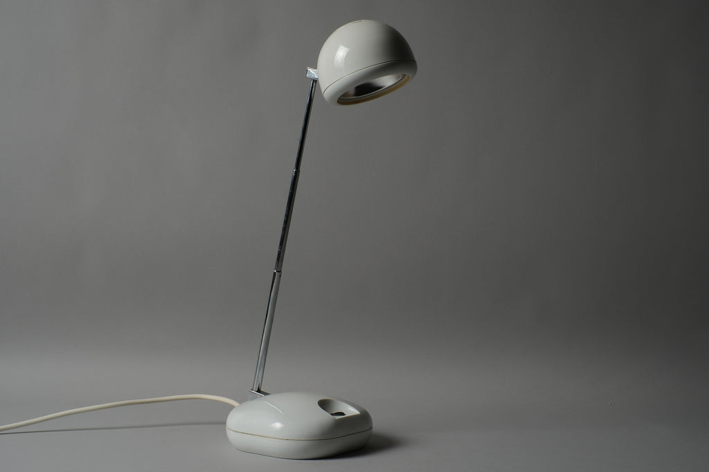 Profile view of a 1970s Hustadt Leuchten antenna halogen desk lamp from West Germany, showing the full silhouette of the extended telescopic stem, spherical head and oval base against a neutral background.