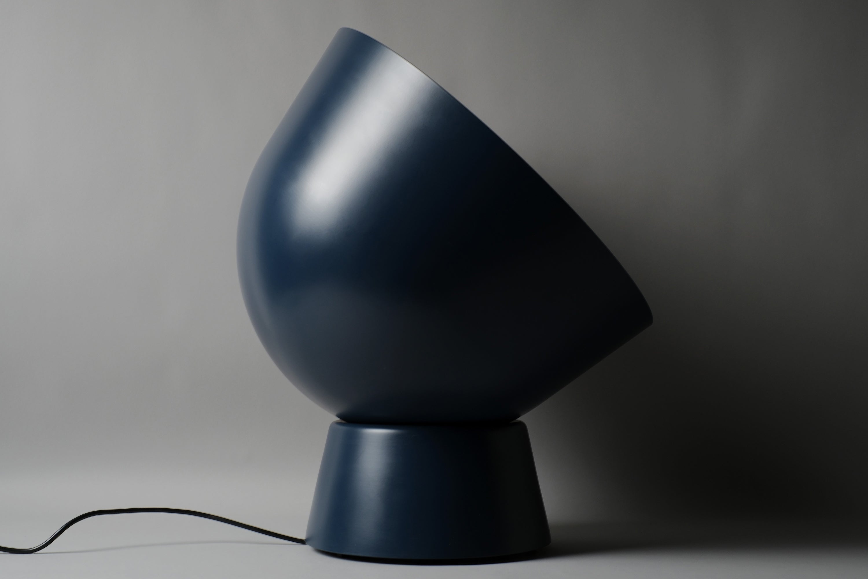 IKEA PS 2017 large floor lamp by Ola Wihlborg, navy blue, showing the relationship between oversized dome and compact spherical base