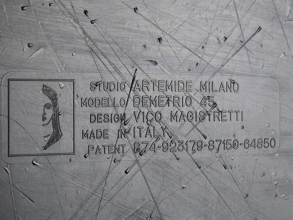 1960s MCM Artemide Milano 'Demetrio 45' black fiberglass side table by Vico Magistretti, macro close up of the authenticity stamp, Made in Italy.