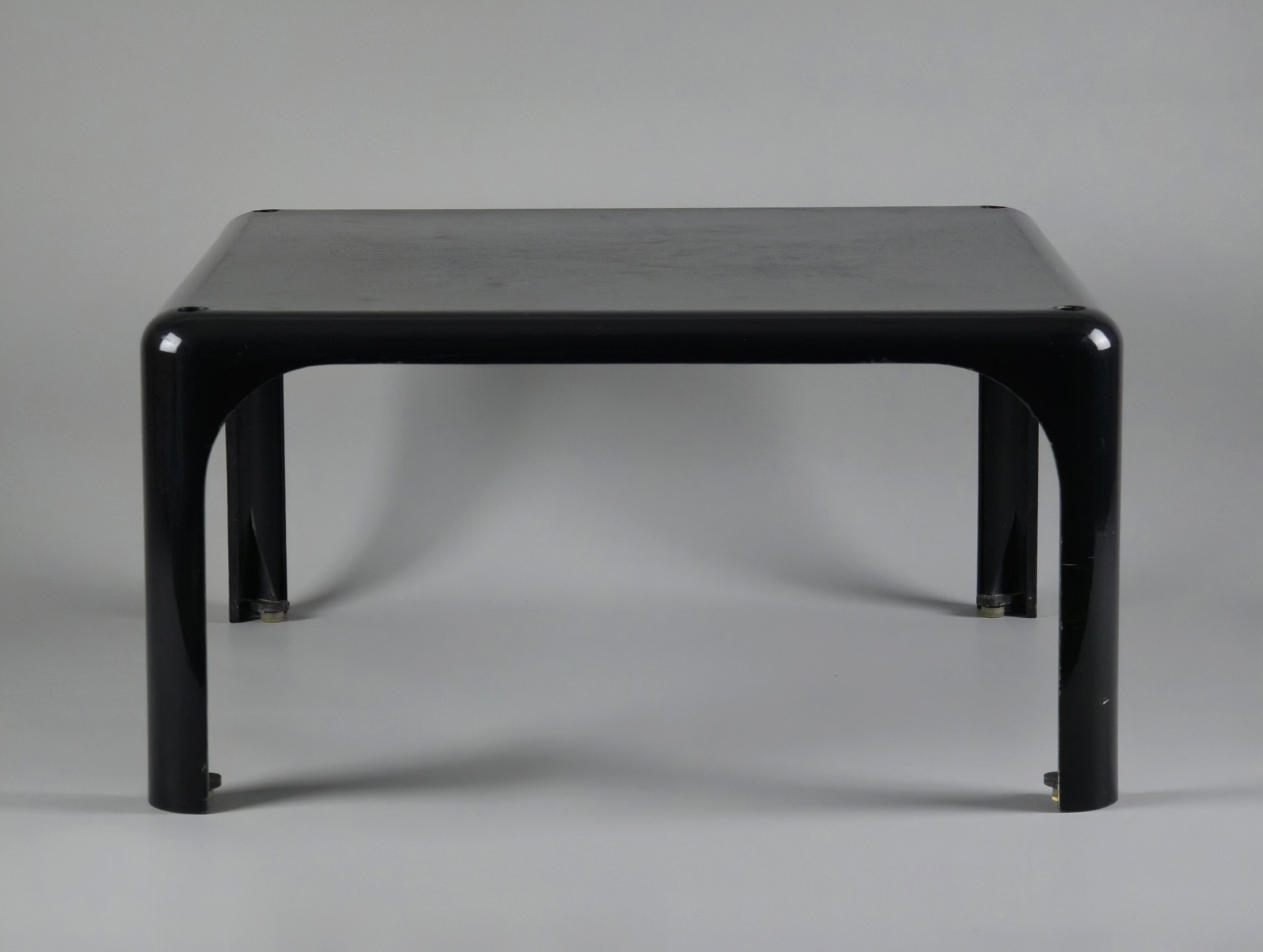 1960s MCM Artemide Milano 'Demetrio 45' black fiberglass side table by Vico Magistretti, front view slightly from the top end to show the depth feel of the table.