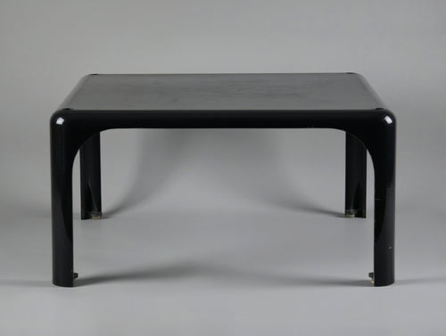 1960s MCM Artemide Milano 'Demetrio 45' black fiberglass side table by Vico Magistretti, front view slightly from the top end to show the depth feel of the table.