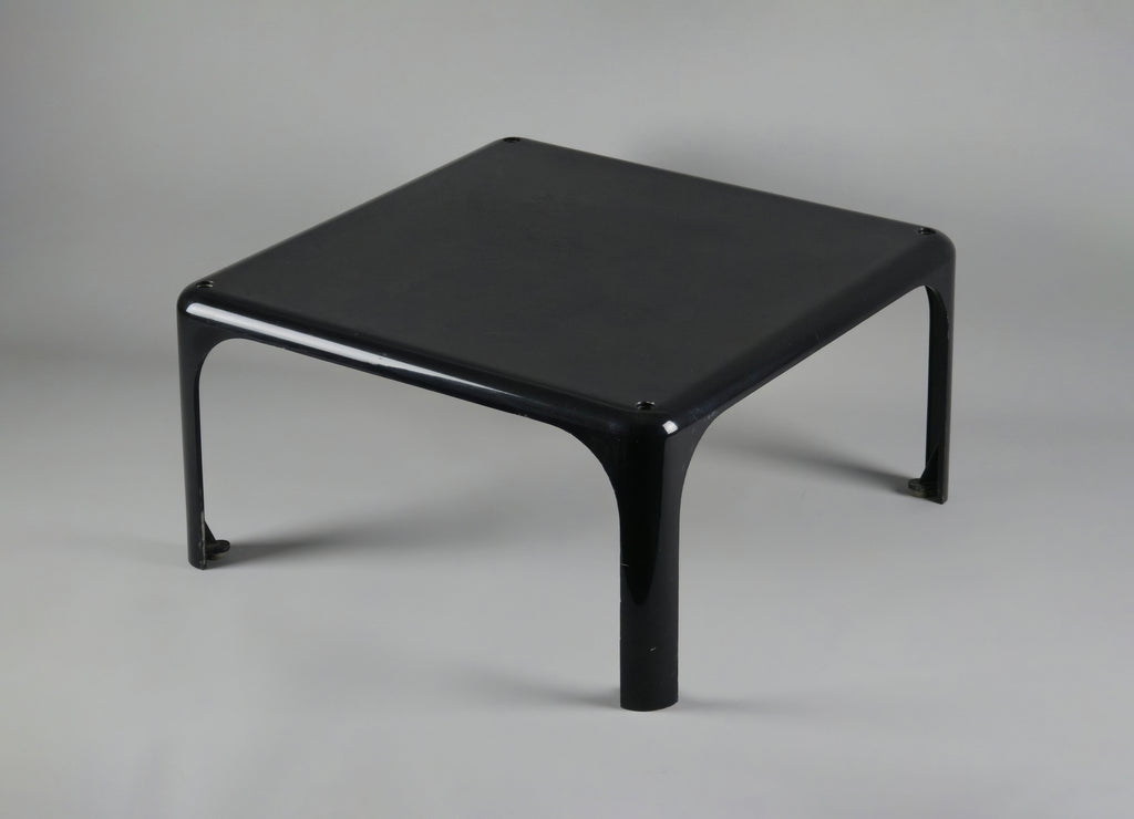1960s MCM Artemide Milano 'Demetrio 45' black fiberglass side table by Vico Magistretti, main image showing the table slightly from the top and angular view to show the depth.