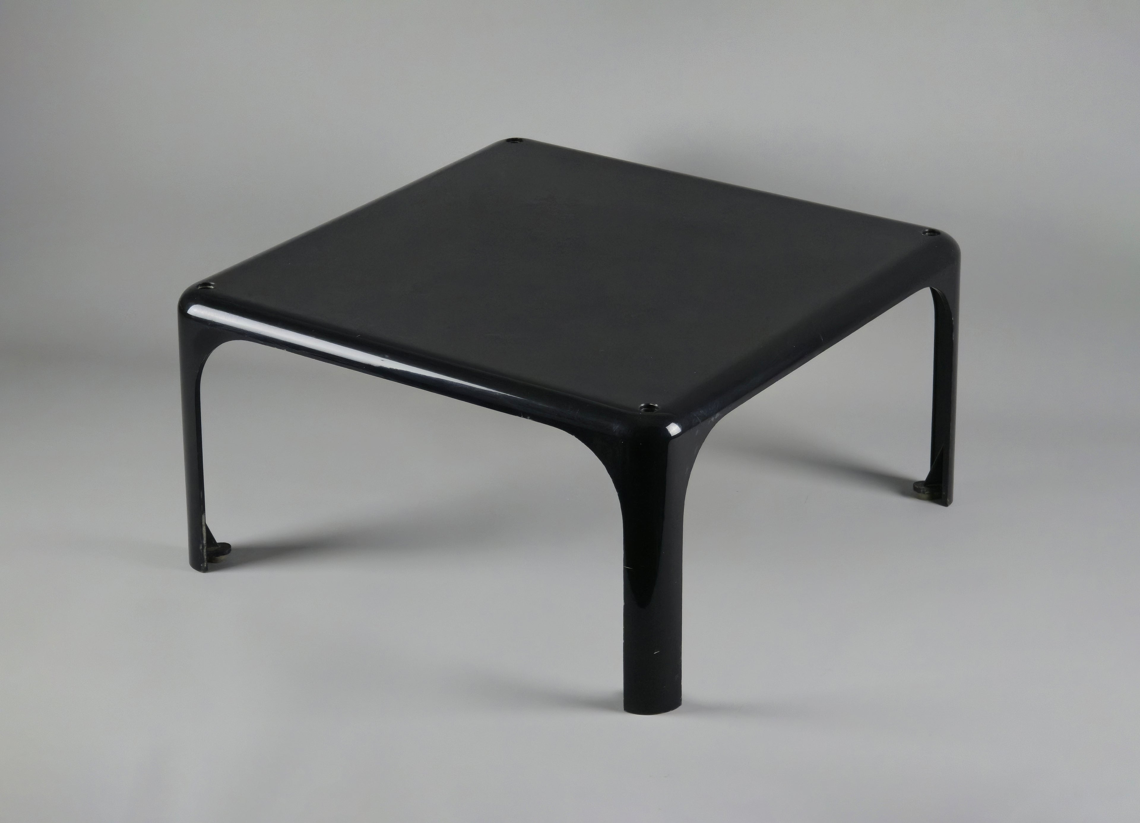 1960s MCM Artemide Milano 'Demetrio 45' black fiberglass side table by Vico Magistretti, main image showing the table slightly from the top and angular view to show the depth.