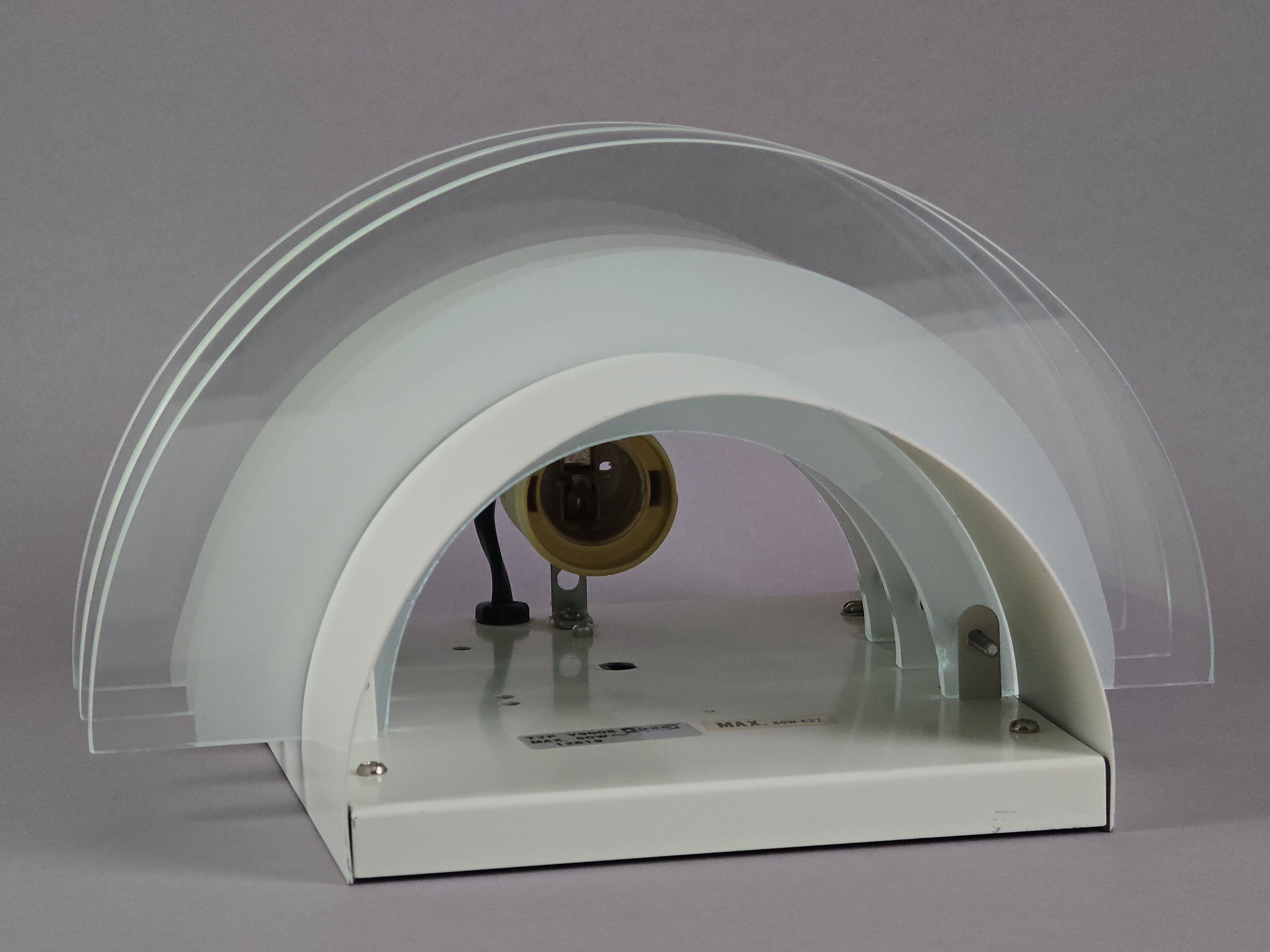 Interior detail of the IKEA Drittel lamp featuring the original ceramic socket and electrical wiring for global use.