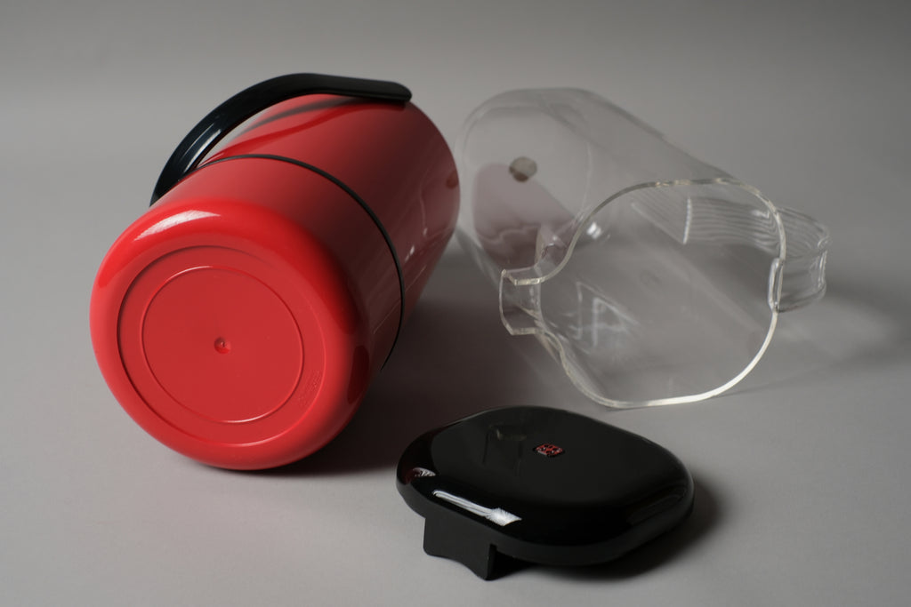 Guzzini Amanda pitcher and Scaroni wine cooler, showing base construction and manufacturer markings, Italy 1970s