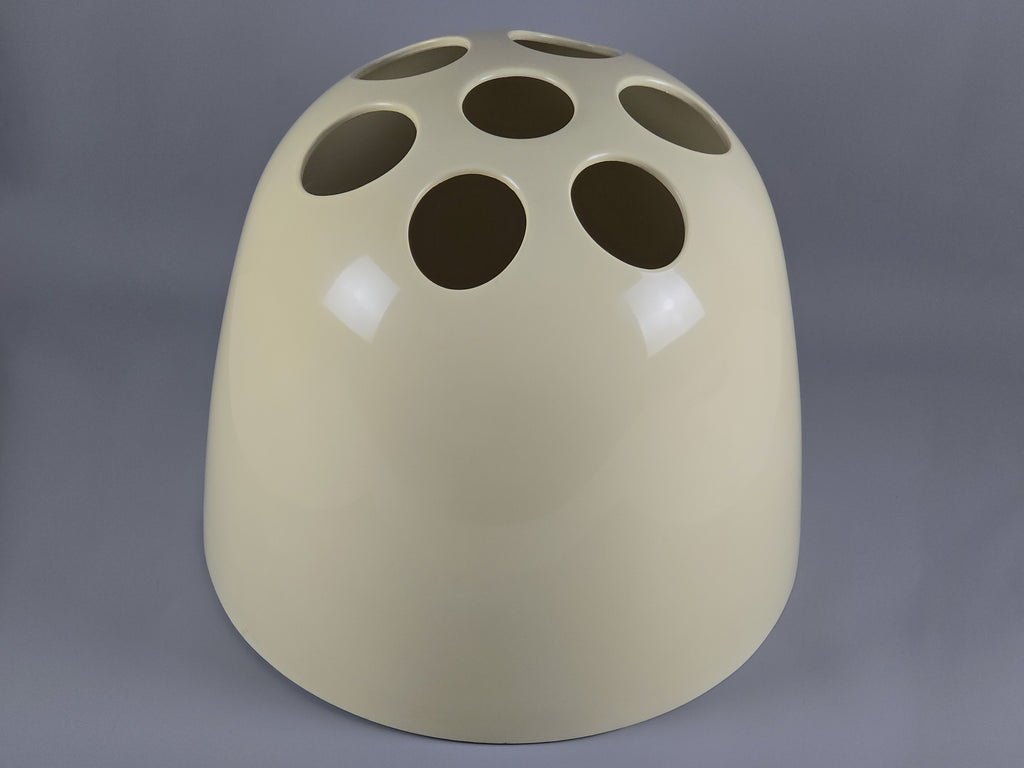 Side profile showing the iconic circular cutouts of the Space Age Dedalo stand.