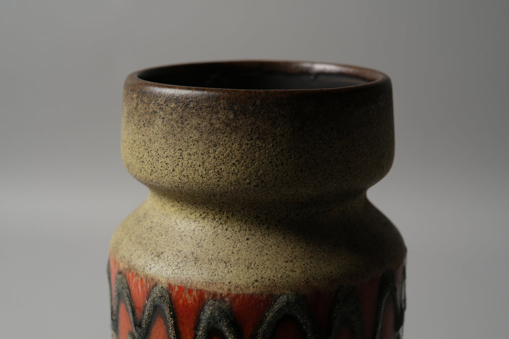 VEB Haldensleben fat lava vase, showing dark brown matte neck glaze transitioning to the relief decoration below, East Germany 1960s