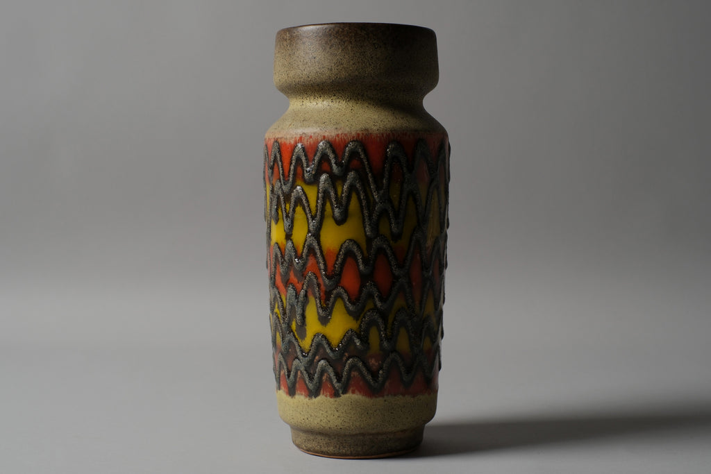 VEB Haldensleben fat lava vase, 24cm, zigzag relief in orange and yellow with charcoal ridges on sandy matte body, East Germany 1960s