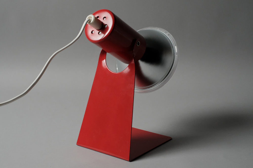 Rear angle of the vintage 1970s Gnosjo Konstsmide Swedish MCM red metal industrial desk lamp showing the cylindrical socket housing.