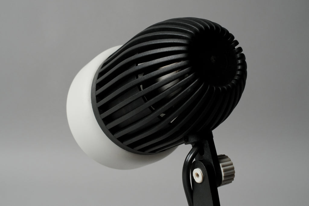 Macro shot of the adjustable pivot joint on the vintage 1970s Aro Leuchte modernist adjustable desk lamp allowing for custom tilting.