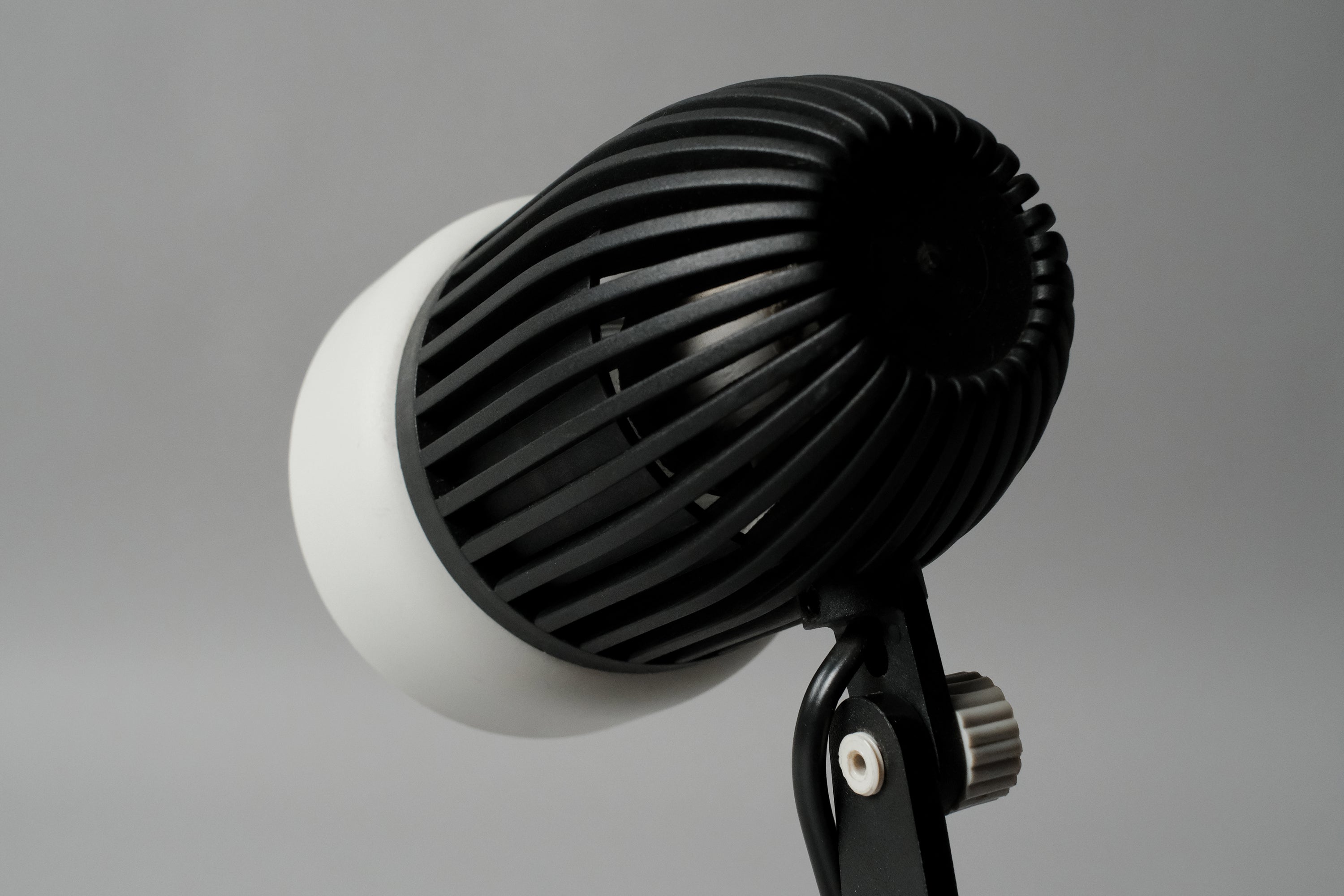 Macro shot of the adjustable pivot joint on the vintage 1970s Aro Leuchte modernist adjustable desk lamp allowing for custom tilting.