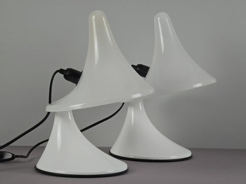 Side profile of the Karin-M Italian design lamps, highlighting the elegant organic curves of the Perspex body. The image shows a pair of the lamps, side by side in three-quarters profile view.