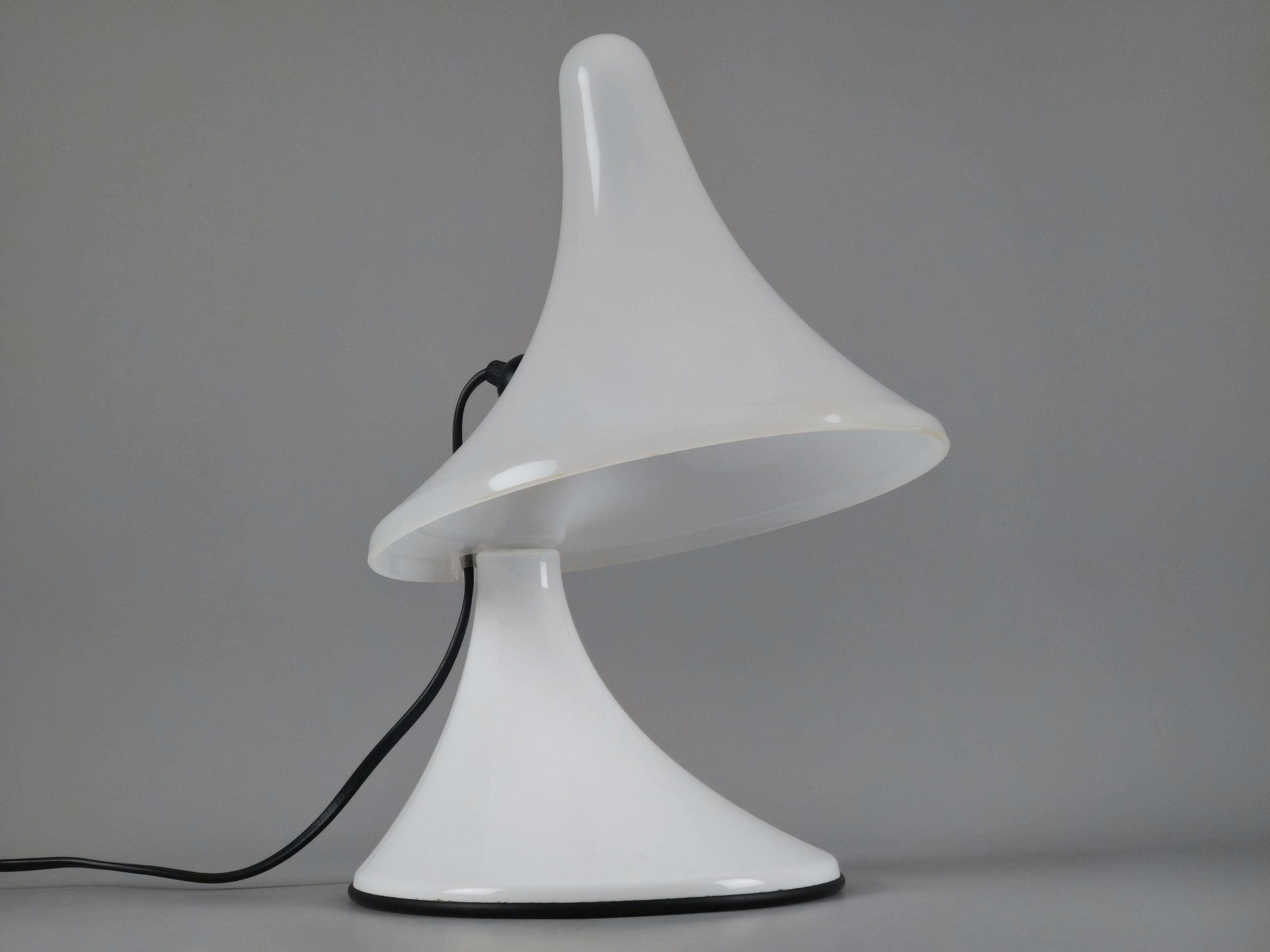 Side profile of the Karin-M Italian design lamp, highlighting the elegant organic curves of the Perspex body.