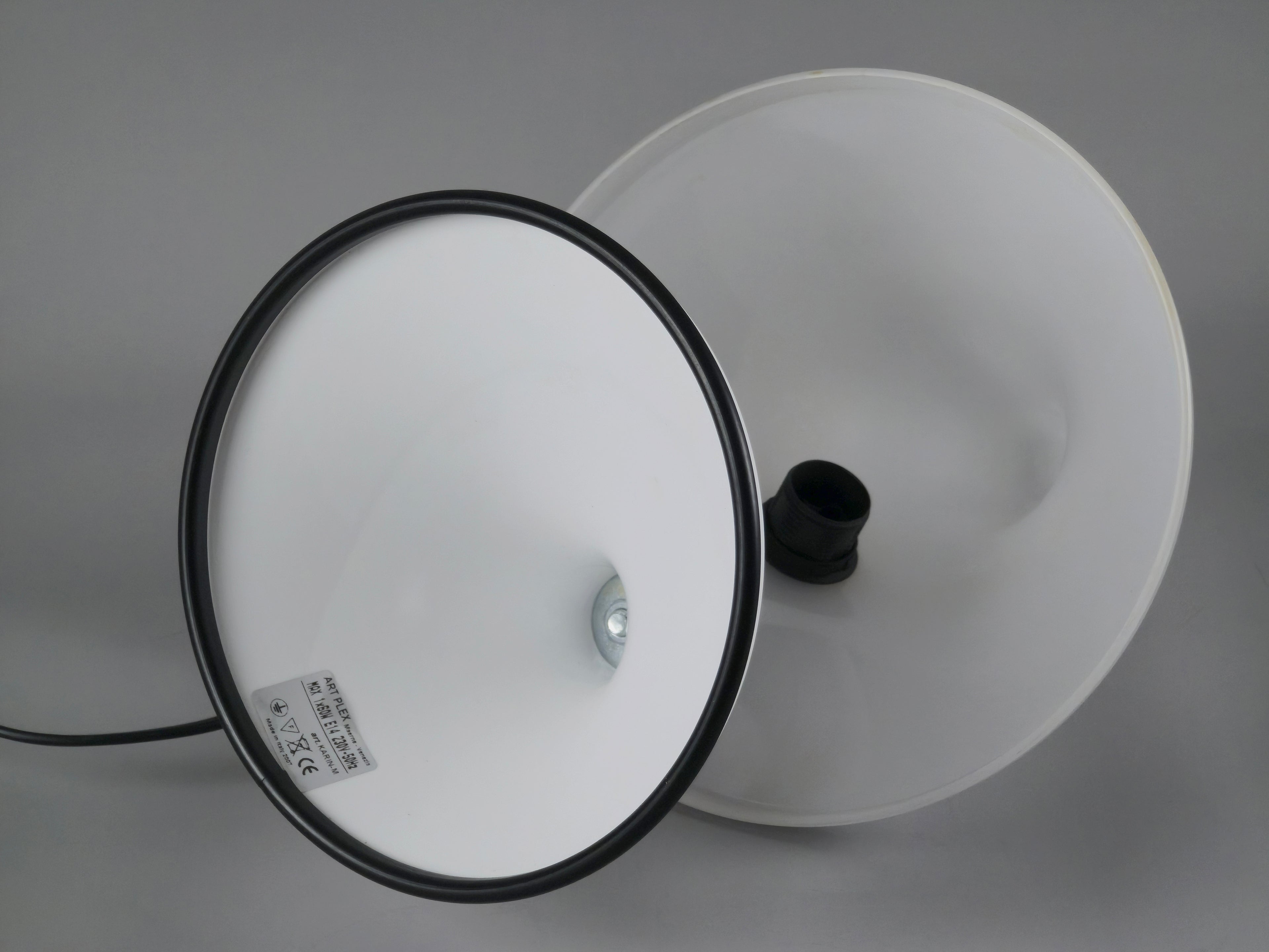 Underside view of the lamp base showing the original construction and secure weighted bottom for stability.