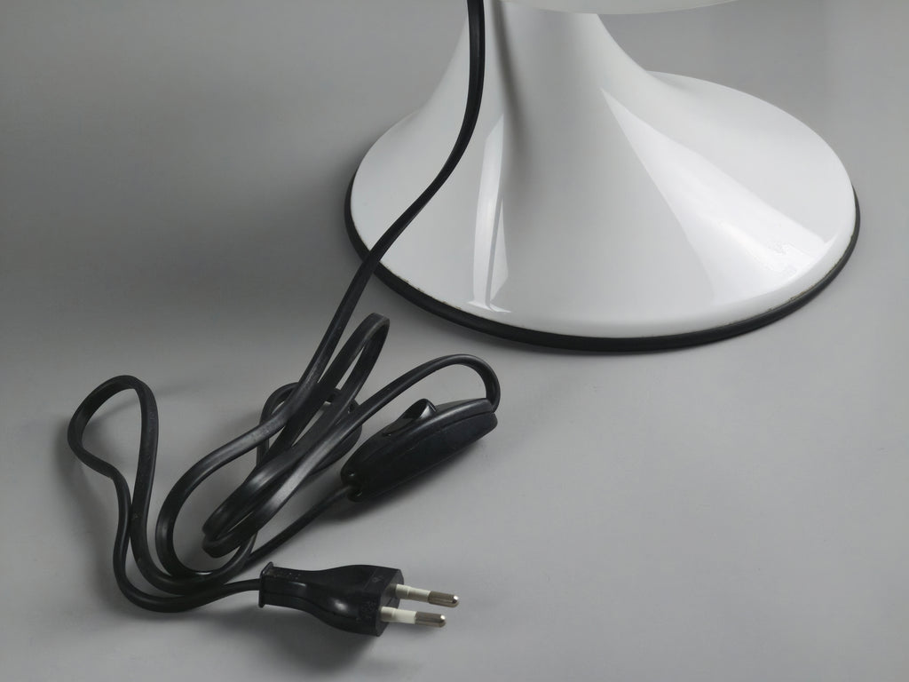 Detail of the original black electrical cord and plug, emphasizing the authentic vintage components of the Art Plex lamp.