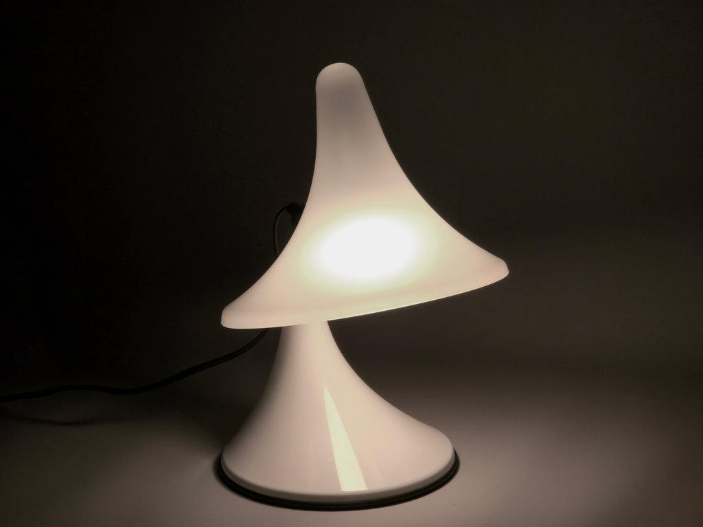 The Karin-M lamp glowing in a dark setting, demonstrating its capability as an ambient mood light.