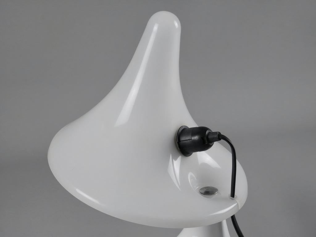 Close-up perspective of the curved shade "fin," highlighting the architectural postmodern lines of the Italian design.