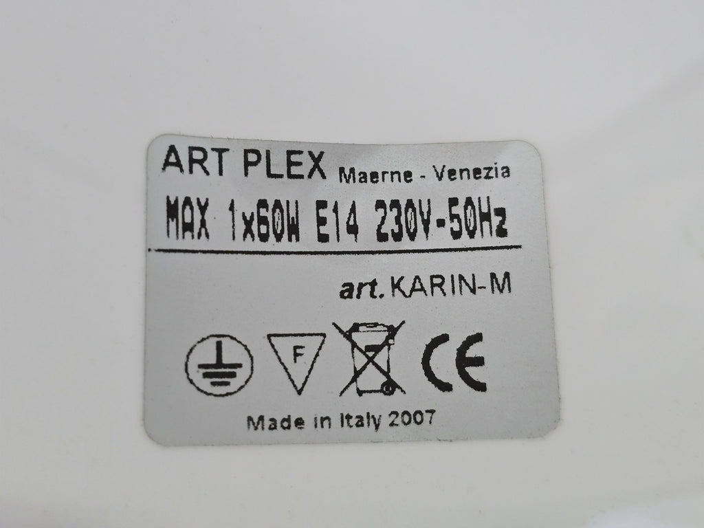 Macro shot of the underside view of the lamp base showing the original authenticity sticker.