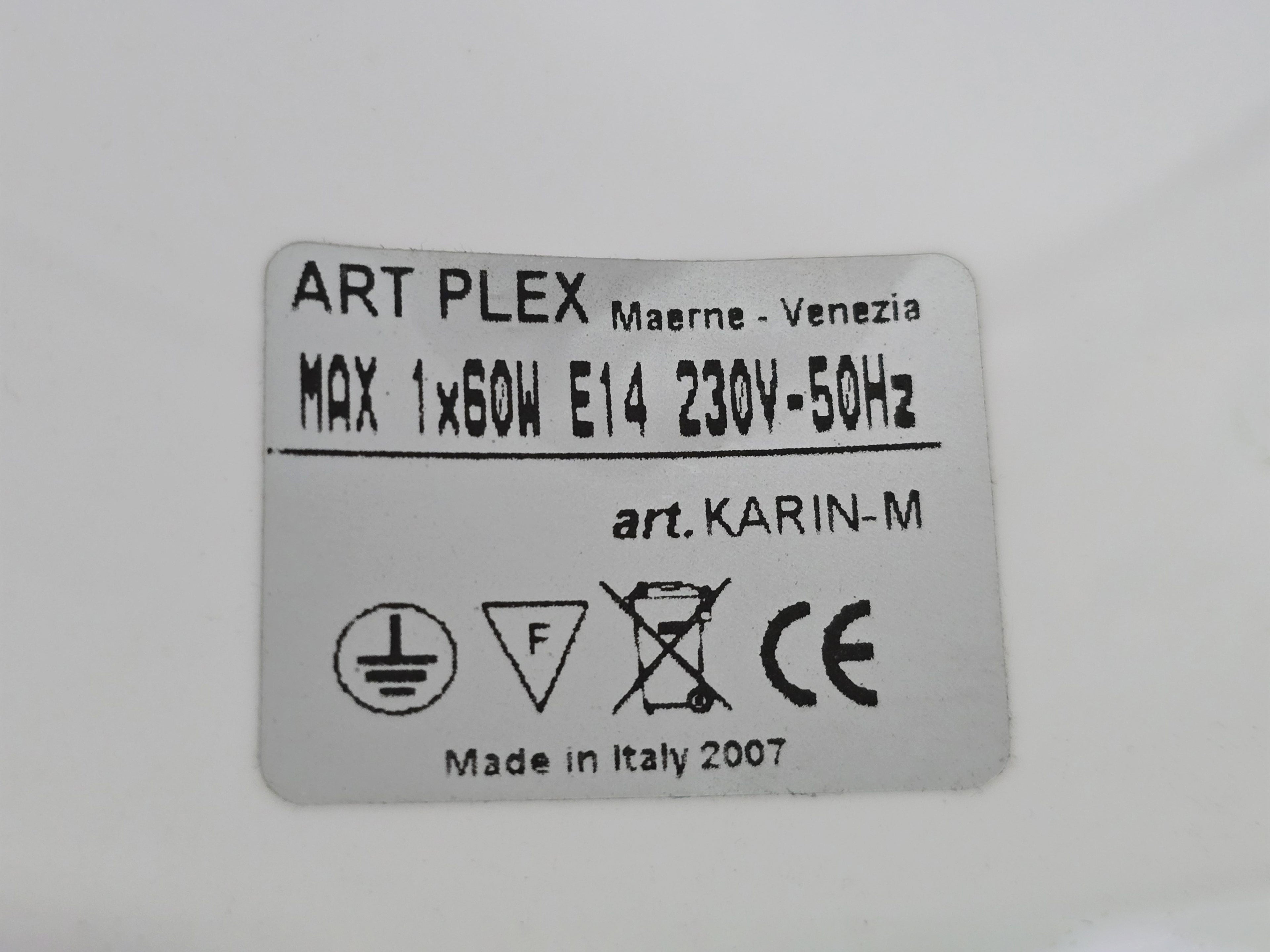 Macro shot of the underside view of the lamp base showing the original authenticity sticker.